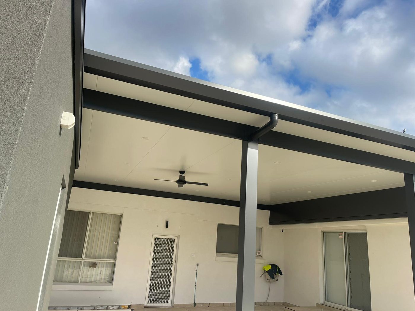New alfresco addition with ceiling fan, freshly painted