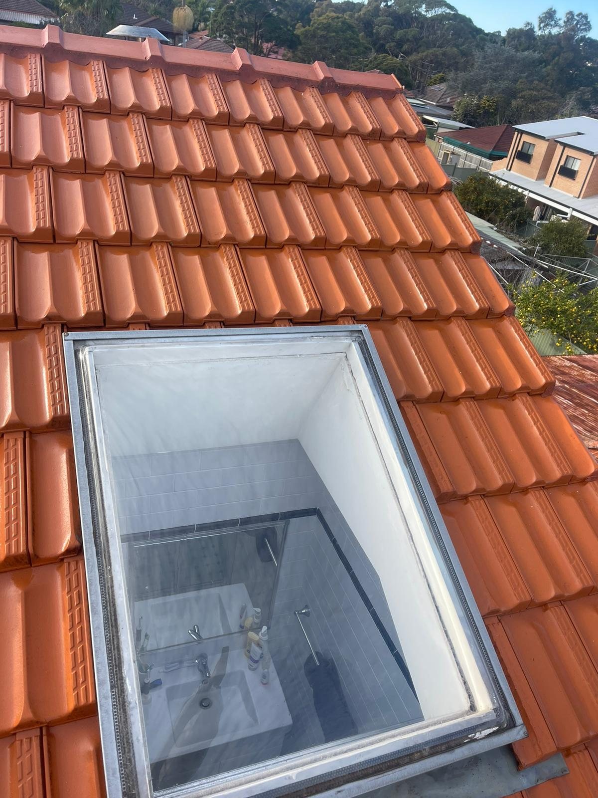 Skylight flashed and sealed into a restored terracotta roof
